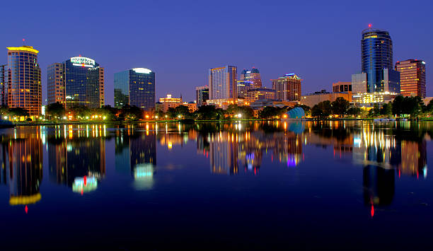 Orlando Cityscape in Early Morning Orlando from Lake Eola lake eola stock pictures, royalty-free photos & images