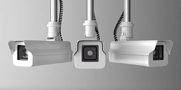 Vector illustration of three security cameras stock photo