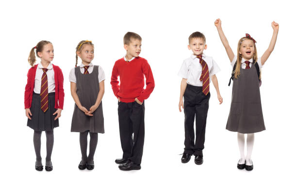 Group of energetic elementary school students running joyfully through the bustling school hallway, filled with laughter and excitement