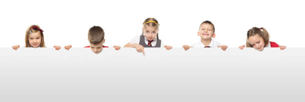 School Kids With A Blank White Board Five school kids in a row behind a blank white board, each one with a unique expression. kids using smart board stock pictures, royalty-free photos & images