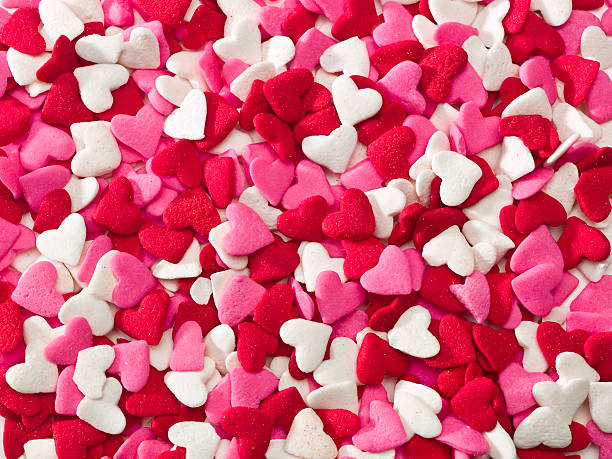 beaucoup de sprinkle coeur - valentines day candy candy heart heart shape photos et images de collection