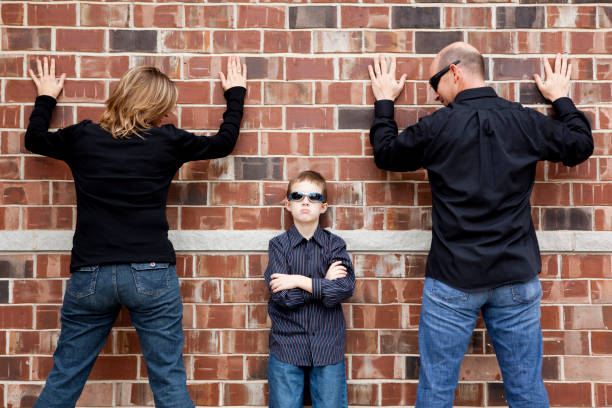 istock BUSTED Parents up against the wall 157511984