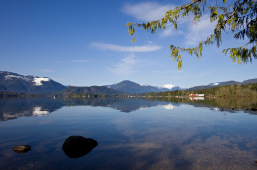 Mountain Lake with water bomber plane base (firefighter planes) in the background (Port Alberni, Vancouver Island)