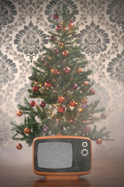 Christmas Dream (Clipping Path) Old BW TV. is in front of a Christmas Tree and foggy atmosphere to create dreamy effect. classic retro tv with white noise stock pictures, royalty-free photos & images