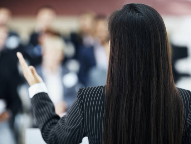istock Rear view of a young speaker at conference 157512532