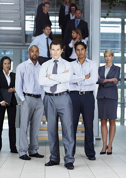 istock Successful businessman standing with colleagues 157512556