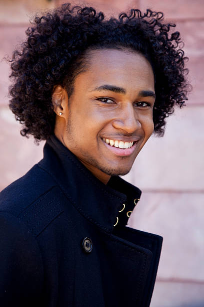 istock smiling Black man wearing pea coat - outdoors 157512691