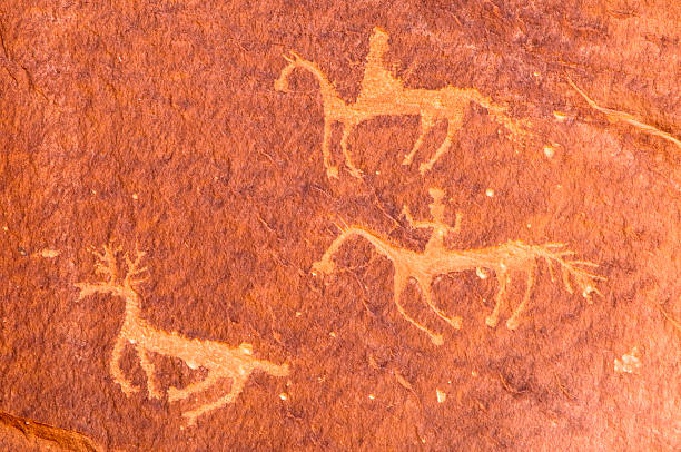 Pictographs of riders on horseback, Canyon de Chelly, Arizona, USA stock photo