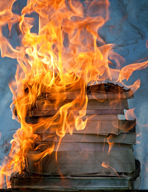 stack of burning books III  book burning stock pictures, royalty-free photos & images