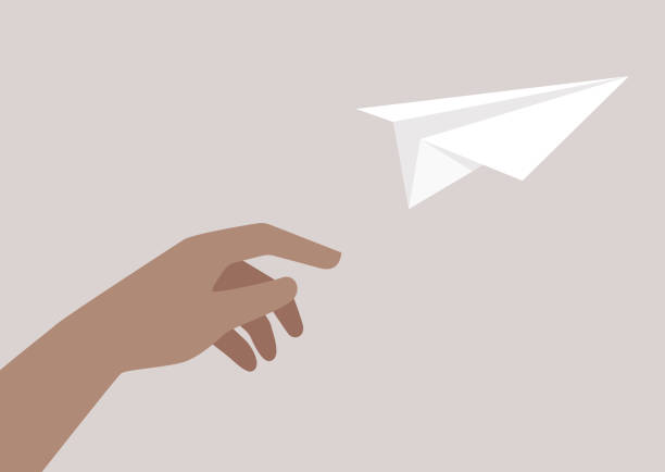 ilustraciones, imágenes clip art, dibujos animados e iconos de stock de la inocencia de la infancia y el poder de la imaginación encarnados en una mano lanzando un avión de papel de origami - simplicity paper airplane airplane journey