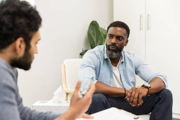 istock Male client seriously considers male therapist's advice 1575141998