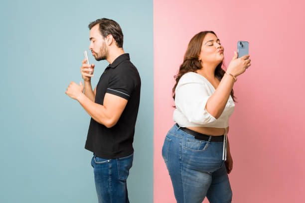 istock Upset couple having problems and fighting talking on the phone 1575172887