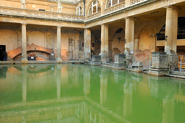 Roman Baths, Bath View of the iconic green Roman Baths in Bath, Somerset, England. XL image size. roman baths stock pictures, royalty-free photos & images