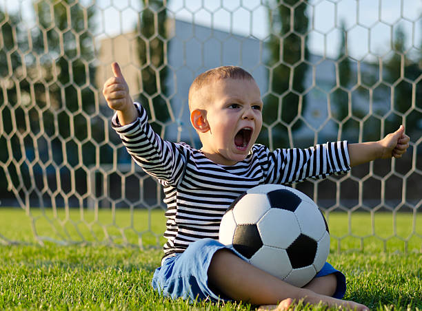 istock Boy with football shouting  glee 157520174