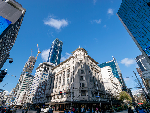 Auckland, New Zealand - July 23rd, 2023: Shops on Queen Street in a sunny day, Auckland, New Zealand