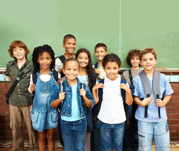 istock Cheerful group of school students standing together 157522256