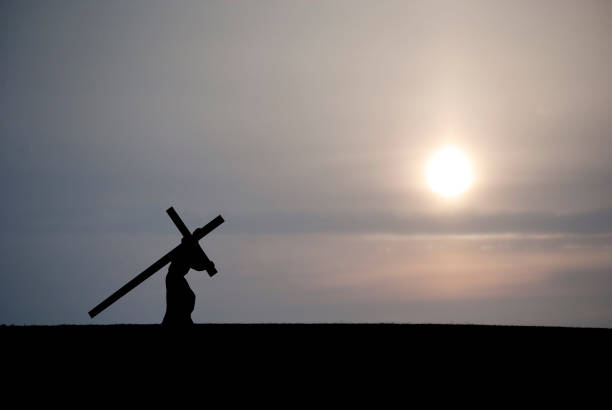 istock Christ Carrying the Cross... Dark Sunset 157522298