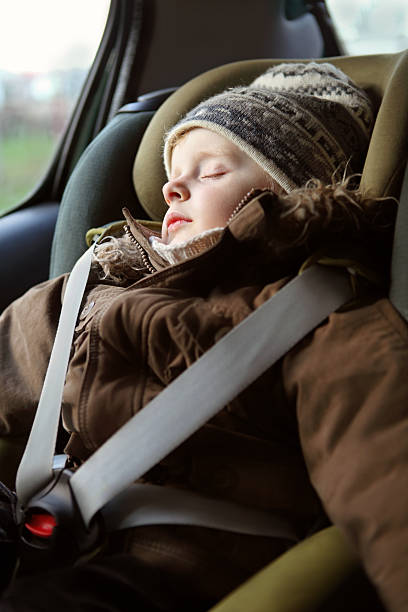 istock Little Boy Sleeping in the Child Seat 157522515