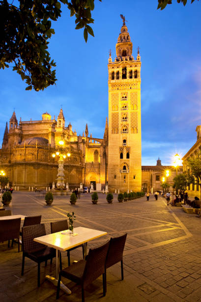 Pope John Paul II Statue (Juan Pablo II) and Giralda (Torre de la Giralda) at Plaza Virgen de Los Reyes, Seville (Sevilla), Andalusia, Southern Spain