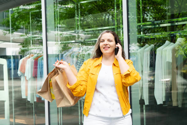istock Happy woman shopping 1575225751