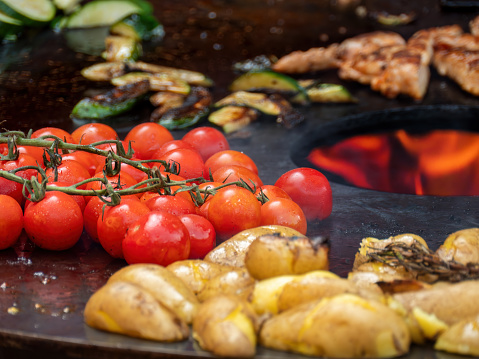 Grilled Potatoes, Vine-Ripened Tomatoes, and Vegetables on the BBQ Grill