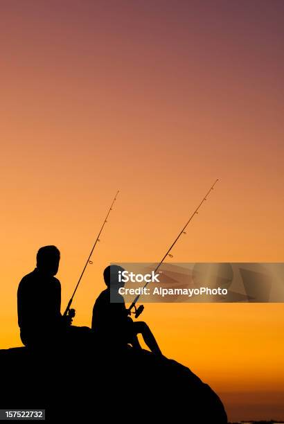 Little Boy And His Grandfather Fishing At Sunset V Stock Photo - Download Image Now