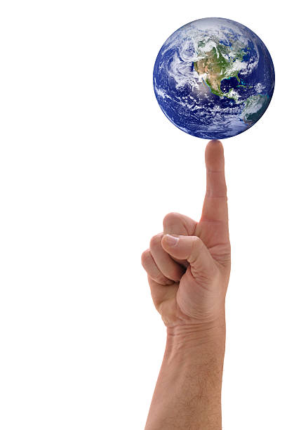Planet Earth Balanced Finger Tip, Hand Holding Globe, White Background This image can be seen as Planet Earth in the hands of God, or possibly in the hands of mankind. finger spinning globe stock pictures, royalty-free photos & images