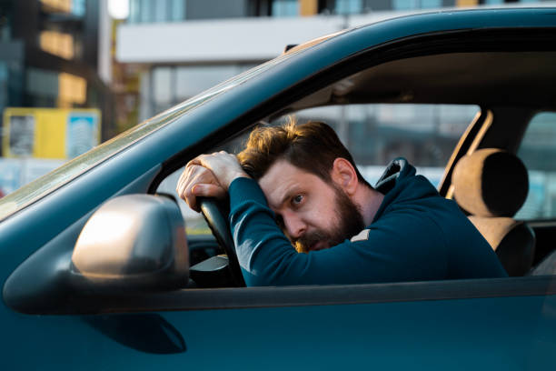 Desperate man behind the wheel, car crash or problems with the car