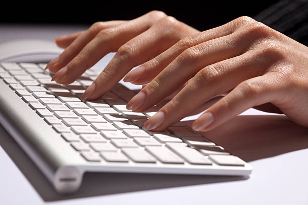 istock Woman's Hands Fingers Typing, Data Entry, Modern White Aluminum Keyboard 157522971