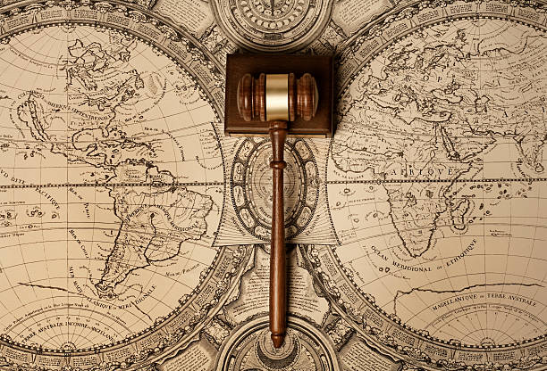 Gavel on old world map Gavel of justice on old world map aluxum stock pictures, royalty-free photos & images