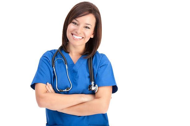 alegre jovem enfermeira em azul uniforme hospitalar - female nurse nurse scrubs female doctor imagens e fotografias de stock