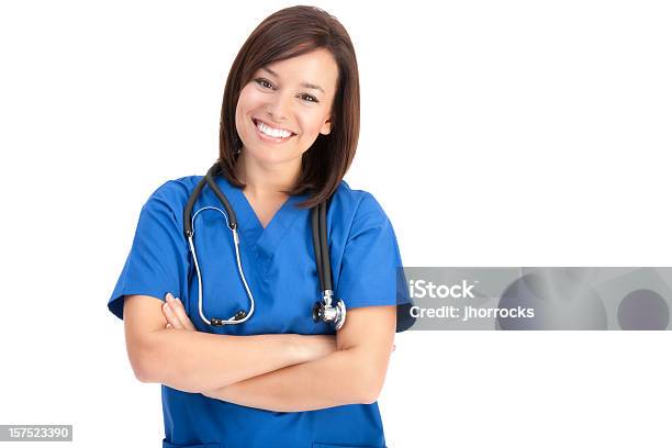 Foto de Alegre Jovem Enfermeira Na Azul Esfoliações e mais fotos de stock de Profissional de enfermagem - Profissional de enfermagem, Fundo Branco, Enfermeira