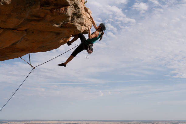 Woman rockclimbing stock photo