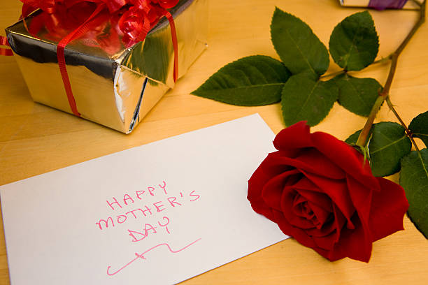 Vintage letter with rose and satin ribbon.