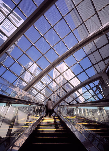 istock Business man on escalator in Tokyo, Japan. 157523690
