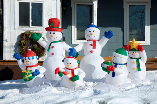An Asian girl building a real snowman outdoors in a gardenSimilar images from my portfolio: