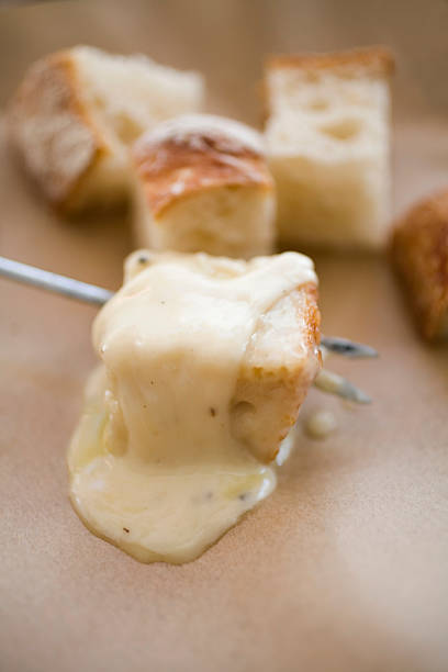 Melted cheese fondue stock photo