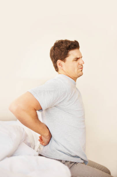 istock Man holding back in pain 157524034
