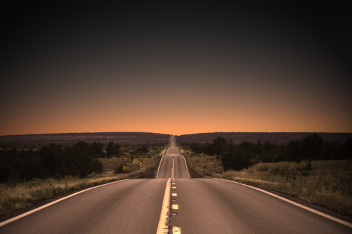 Sunset highway in Northern Arizona. Vignetting and desaturated.