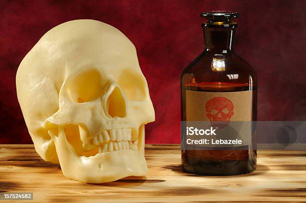 Skull And Bottle Stock Photo - Download Image Now - Abstract, Alchemy, Biology