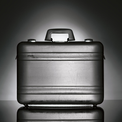 Metal Brief Case on reflective surface