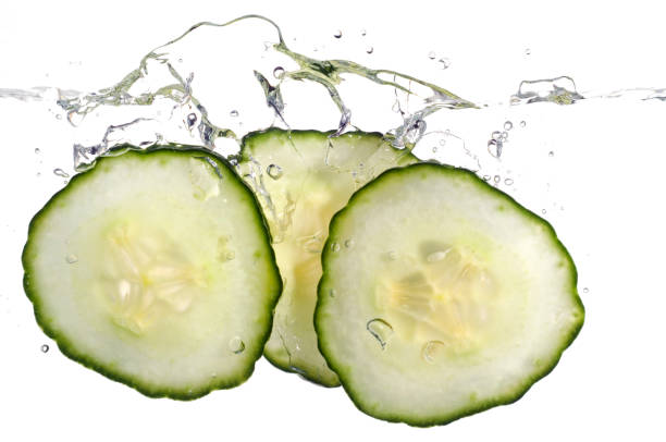 istock Cucumber slices splashing in water 157524963
