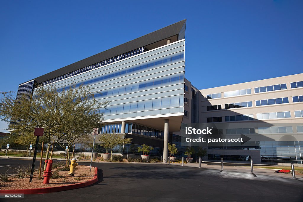 Modern Scottsdale Medical Business Building Scottsdale Arizona angular business building modern 20th century style on a clear day with palo verde trees set on a bright blue clear sky background Hospital Stock Photo