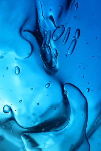 Close-up on a blue hair gel, with bubbles. Other images in: 