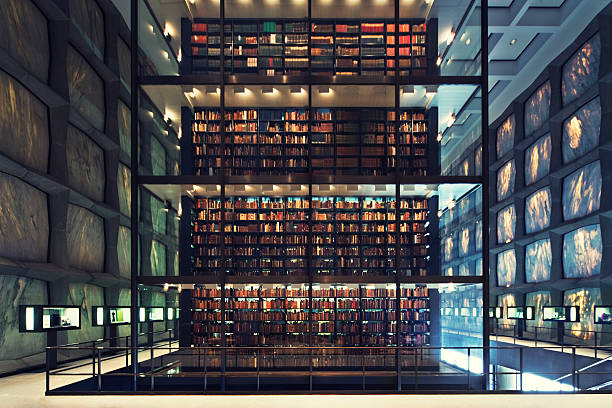 postmodern library wonderful library bulit in 1960s - marble facade with hudge glass cube in the middle - slight cross tretment - camera canon 5D mark II  - unshapred RAW - adobe colorspace bookshelf library book bookstore stock pictures, royalty-free photos & images
