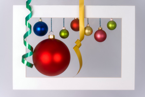 Colorful Christmas balls and ribbons in a frame that softened by 