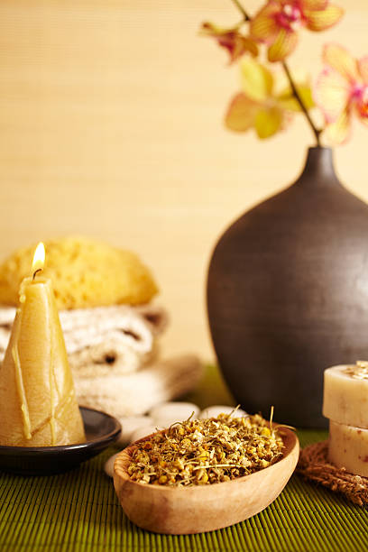 istock Spa still life chamomile herbs in a wooden bowl 157525495