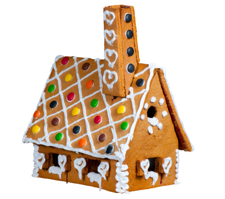 Christmas gingerbread house, gingerbread man with New Year and Christmas decor, sleigh on a snowy background. Christmas winter composition.