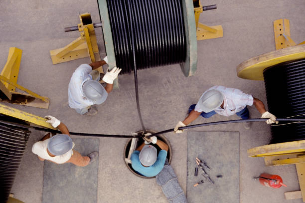 Overhead shot of electricians working  stock photo