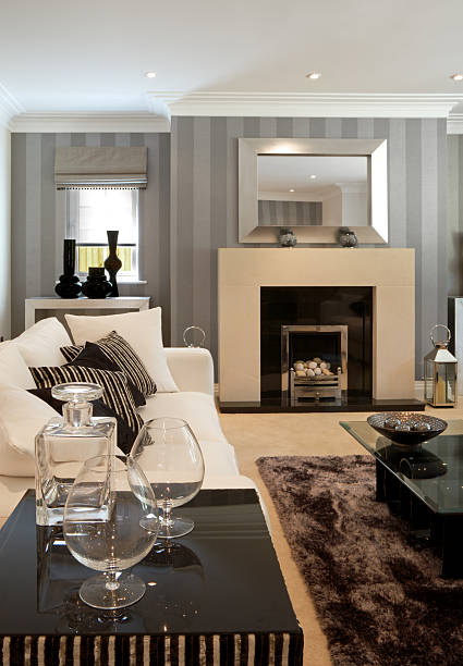 Fireplace in a blue classic room with windows and wooden ceiling - 3d rendering\n